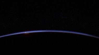 Dünya Gündoğumu Atmosferden, NASA tarafından desteklenen bu videonun elementlerinin yakınından geçen devasa bir göktaşı ile görülüyor.