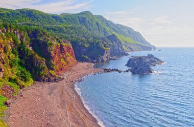 Misty Hills Above a Remote Beach in the Green Gardens in Gros Morne National Park in New Foundland