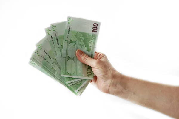 Hand Hält Einen Großen Stapel Eurogeld Isoliert Auf Weißem Hintergrund lizenzfreie Stockbilder
