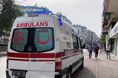 Turkey, Antalya - 11 11 2022: Turkish ambulance vehicle on the city street. Emergency help. Ambulance service 112. Outddors
