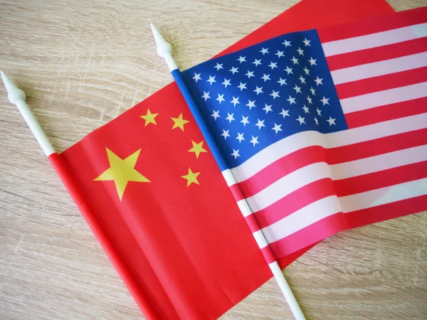 China and United States flags, red with yellow stars Chinese flag and half usa united states of america flag, concept
