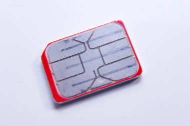 Person inserting a sim card into back of mobile phone, Sim card in tray being inserted into phone, closeup