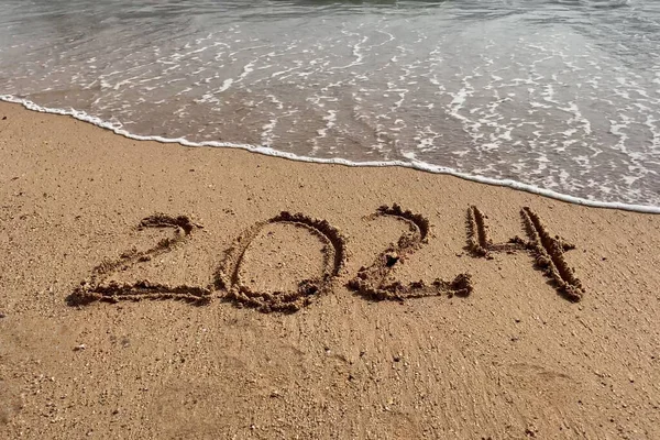 Happy New Year Concept Text 2024 Handwritten Sand Surface Blue — Stock Photo, Image