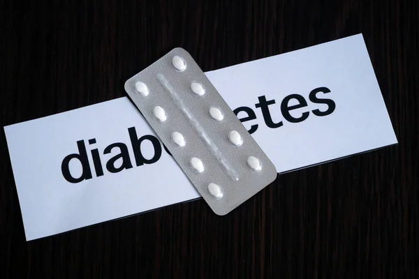 Pills Blister Two Pieces Paper Text Diabetes Black Wooden Background — Stock Photo, Image