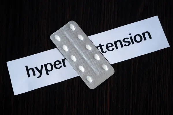 Pills Blister Two Pieces Paper Text Hypertension Black Wooden Background — Stock Photo, Image