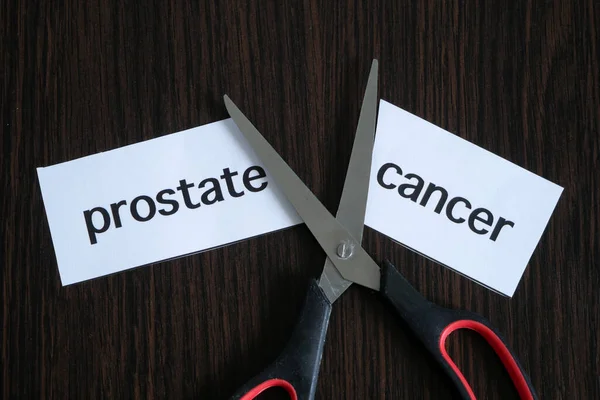 Scissors Cutting Paper Text Prostate Cancer Black Wooden Background Successful Stock Picture