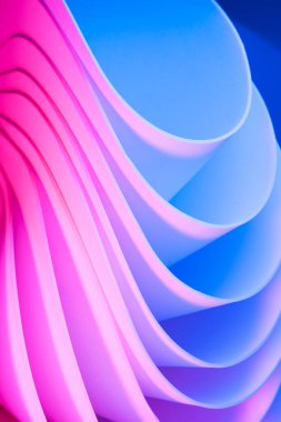 Magenta and blue abstract curvy shape against the colorful pink background. Futuristic dynamic template