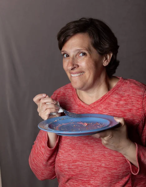 Older Woman Empty Blue Plate High Quality Photo Showing Woman — Stockfoto