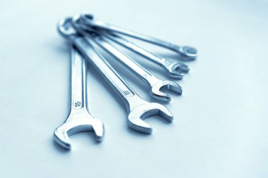 Wrenches on white background in different sizes. Equipment too