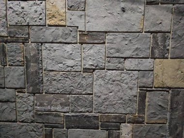 Doğal taş dokusunun fotoğrafı. Duvarın dokusu doğal taştan yapılmış.