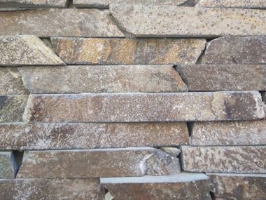 Doğal taş dokusunun fotoğrafı. Duvarın dokusu doğal taştan yapılmış.