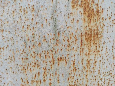 Paslı bir dokunun fotoğrafı. Eski paslı, yıpranmış metal