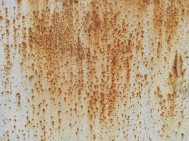 Paslı bir dokunun fotoğrafı. Eski paslı, yıpranmış metal