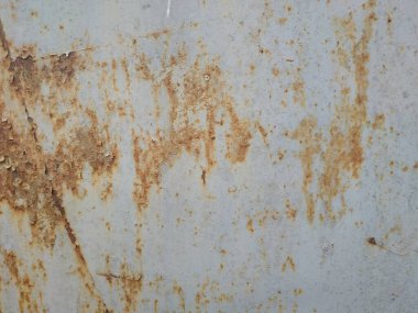 Paslı bir dokunun fotoğrafı. Eski paslı, yıpranmış metal