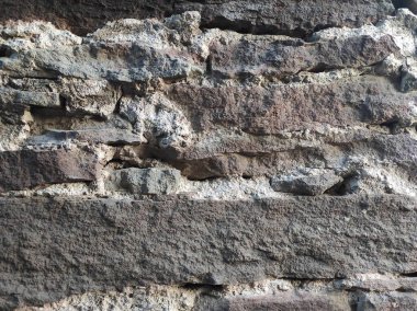 Doğal taş dokusunun fotoğrafı. Duvarın dokusu doğal taştan yapılmış.