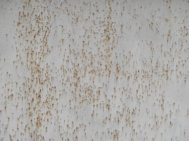 Paslı bir dokunun fotoğrafı. Eski paslı, yıpranmış metal