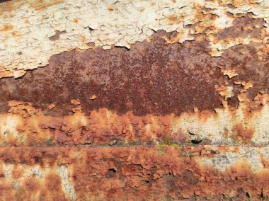 Paslı bir dokunun fotoğrafı. Eski paslı, yıpranmış metal