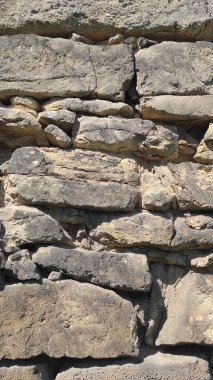 Taş dokusu. Dikey 16x9. Doğal taşın fotoğrafı. Doğal taş.