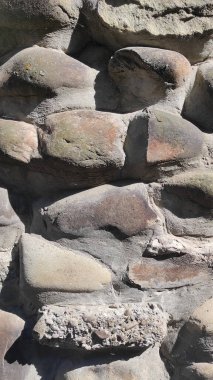 Taş dokusu. Dikey 16x9. Doğal taşın fotoğrafı. Doğal taş.