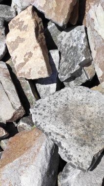 Taş dokusu. Dikey 16x9. Doğal taşın fotoğrafı. Doğal taş.