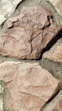 Taş dokusu. Dikey 16x9. Doğal taşın fotoğrafı. Doğal taş.