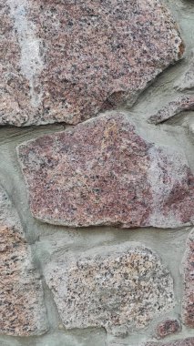 Taş dokusu. Dikey 16x9. Doğal taşın fotoğrafı. Doğal taş.