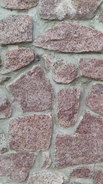 Taş dokusu. Dikey 16x9. Doğal taşın fotoğrafı. Doğal taş.