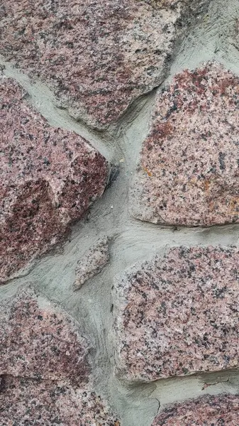 Taş dokusu. Dikey 16x9. Doğal taşın fotoğrafı. Doğal taş.