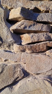 Taş dokusu. Dikey 16x9. Doğal taşın fotoğrafı. Doğal taş.