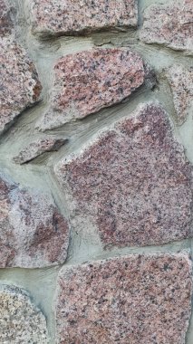 Taş dokusu. Dikey 16x9. Doğal taşın fotoğrafı. Doğal taş.