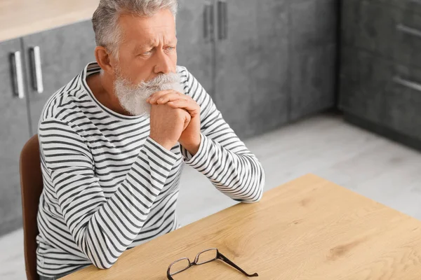 Thoughtful Mature Man Sitting Table Kitchen — Stock Photo, Image
