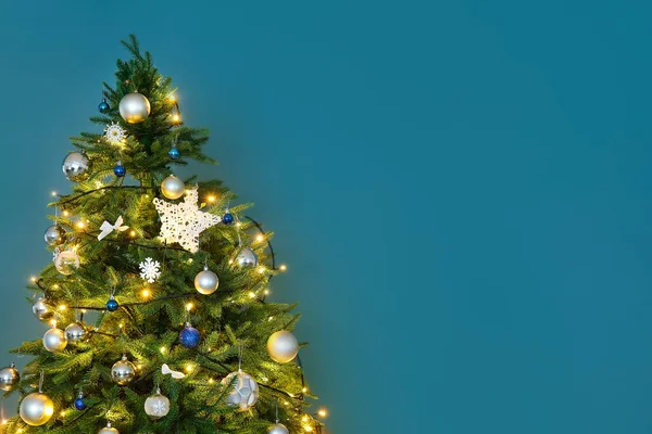 Glowing Christmas Tree Blue Wall Closeup — Stock Photo, Image