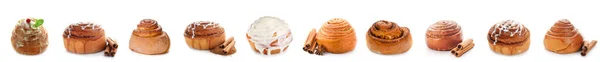 一组甜甜的肉桂面包 在白色上隔离 — 图库照片
