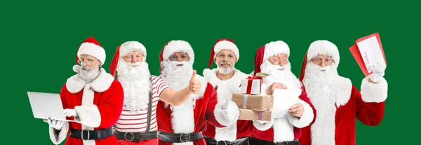 Many Santa Clauses Green Background — Stock Photo, Image
