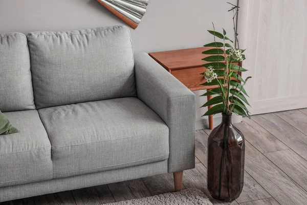 stock image Vase with beautiful ikebana in modern living room