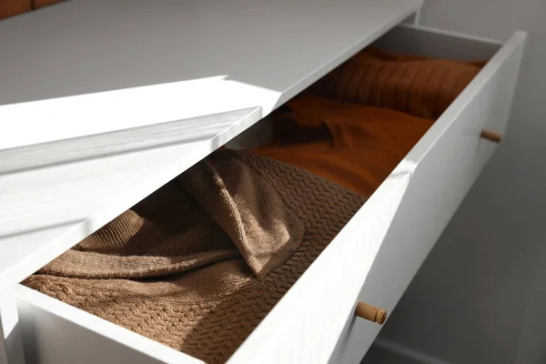 stock image Open drawer with warm clothes, closeup