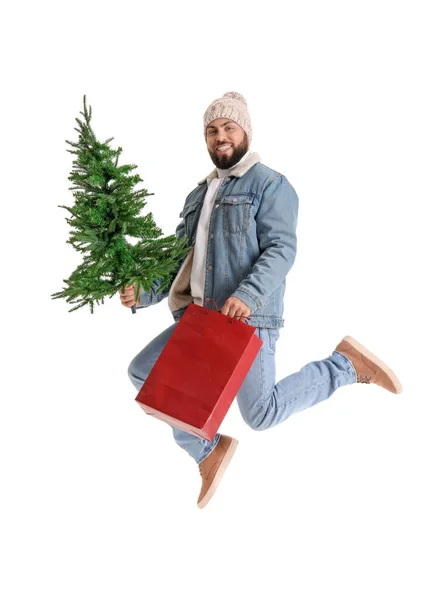 Knappe Man Met Kerstboom Boodschappentas Witte Achtergrond — Stockfoto