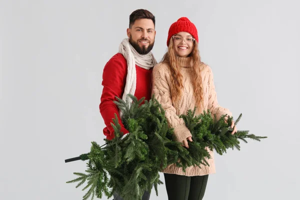 Young Couple Christmas Tree Grey Background — Stock Photo, Image