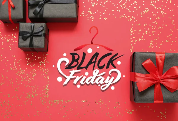 stock image Gift boxes and text BLACK FRIDAY SALE on red background