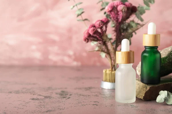 Cosmetic Dropper Bottles Rocks Ikebana Pink Background — Stock Photo, Image