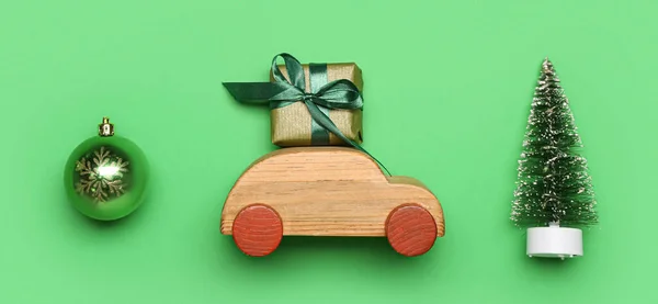 Toy Car Gift Small Christmas Tree Ball Green Background — Stock Photo, Image