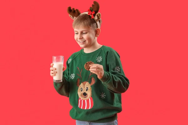 Little Boy Reindeer Horns Glass Milk Cookie Red Background — Stock Photo, Image