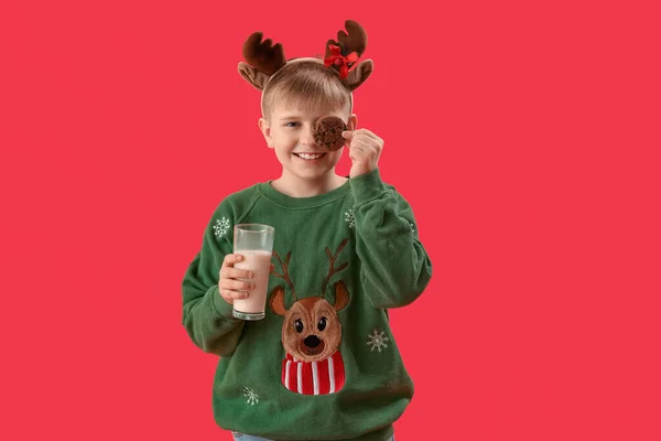 Little Boy Reindeer Horns Glass Milk Cookie Red Background — Stock Photo, Image