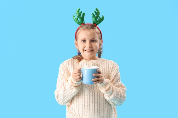 Happy Little Girl Reindeer Horns Cup Cocoa Blue Background — Stock Photo, Image