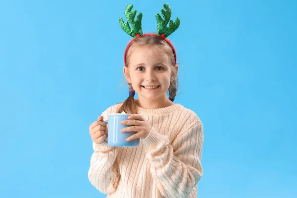 Happy Little Girl Reindeer Horns Cup Cocoa Blue Background — Stock Photo, Image