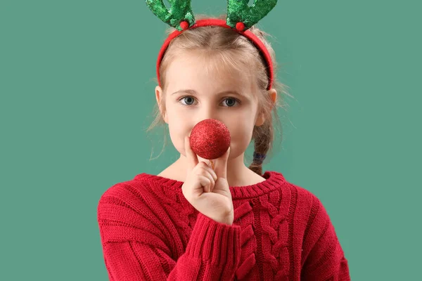 Happy Little Girl Reindeer Horns Christmas Ball Green Background Closeup — Stock Photo, Image
