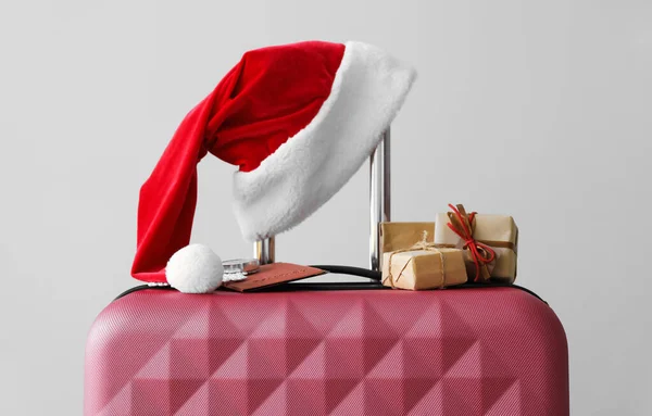 Suitcase Santa Hat Passport Compass Christmas Gifts Grey Background — Stock Photo, Image