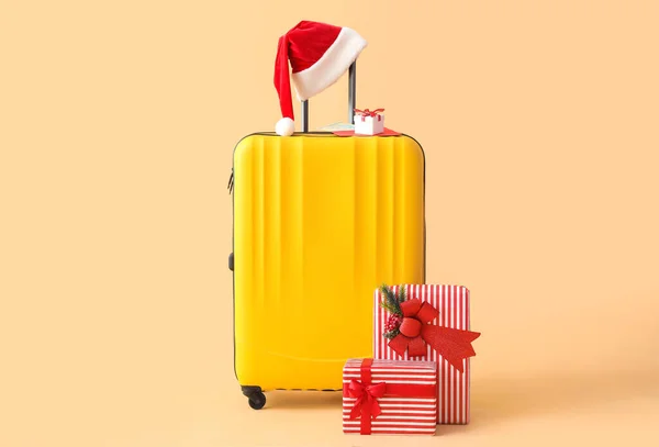 Suitcase Santa Hat Christmas Gifts Beige Background — Stock Photo, Image