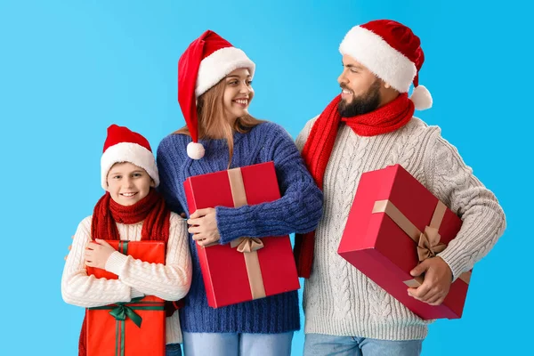 Happy Parents Little Son Santa Hats Christmas Gifts Blue Background — Stock Photo, Image
