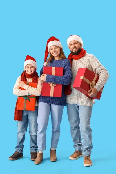Happy Parents Little Son Santa Hats Christmas Gifts Blue Background — Stock Photo, Image
